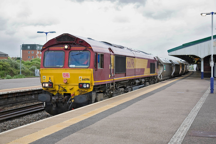 66096, 13.30 Appleford Sidings-Whatley Quarry, Westbury station 
 66096 brings the 13.30 Appleford sidings to Whatley stone empties into Westbury station for a crew change. Without the aggregates traffic from the Mendip quarries, Westbury would be a very different place with virtually no freight. 
 Keywords: 66096 13.30 Appleford Sidings-Whatley Quarry Westbury station