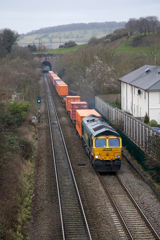 66569, 10.58 Bristol FLT-London Gateway (4L32), Box A4 bridge 
 The position from where I am taking this picture does restrict the angle somewhat, hence the rather head-on shot. 66569 seen, leading the daily 10.58 Bristol FLT to London Gateway Freightliner (4L32), between Box Middle Hill Tunnel, in the distance, and Box Tunnel that is behind me. It is taken from the A4 road bridge in Box village. 
 Keywords: 66569 10.58 Bristol FLT-London Gateway Freightliner 4L32 Box A4 bridge