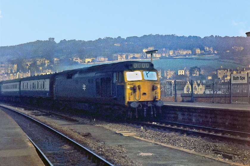 Class 50, unidentified down working, Bath Spa station 
 An unidentified class 50 comes, rather smokily, into Bath Spa station at the head of a down express from London Paddington. At this time, the class 50s or 'Hoovers' as they were known by spotters due to the sound that their forced air induction system made, were not highly thought of by crews and maintenance teams. Notice in the background the large Bath Spa running-in sign. I bought my own on Ebay and and it is proudly displayed in my garden, see the last image on this section. I have often wondered if it this particular one seen in this picture? 
 Keywords: Class 50 Bath Spa station