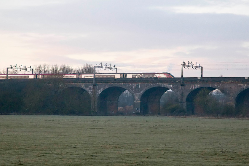 Class 390, VT 07.37 London Euston-Liverpool (1F11), Haversham SP818425 
 The 07.37 London Euston to Liverpool Lime Street crosses Haversham Viaduct in the early morning winter light. I was hoping that the horses that normally occupy the field in the foreground would have been there for added interest. Unfortunately, not today as I suspect that they were safely tucked away in some warm stables somewhere! 
 Keywords: Class 390 1F11Haversham