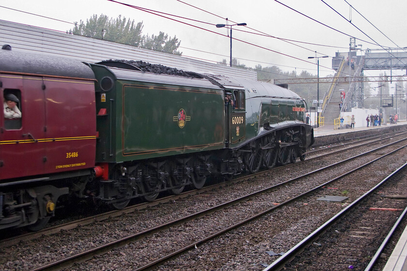 60009, outward leg of The Cheshireman, 07.14 London Euston-Chester (1Z91), Northampton station 
 The awful September weather has not dissuaded enthusiasts to get out and photograph 60009 'Union of South Africa' as it arrives at Northampton station leading The Cheshireman charter running as 1Z91 that left Euston at 07.14. It picked up some passengers at Northampton before heading off to Chester with a couple of other stops on the way. 
 Keywords: 60009 The Cheshireman 07.14 London Euston-Chester 1Z91 Northampton station Union of South Africa