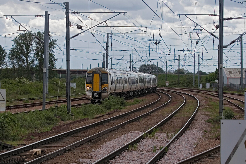 387120, GN 12.12 London King's Cross-Ely (1T28, 4L), Ely station 
 With the cessation of King's Lyn services from King's Cross immanent at the next timetable change it means that all services to and from London will now do what this one is doing, that is terminate at Ely. This will leave King's Lyn with just services to and from Liverpool Street; surely a retrograde step for the somewhat isolated Fenland town? Great Northern's 387120 arrives at Ely with the 1T28 12.12 service from King's Cross. Any passengers wishing to continue north will now have to alight and change for the next ex-Liverpool Street train. 
 Keywords: 387120 12.12 London King's Cross-Ely 1T28 Ely station Great Northern GN Electrostar