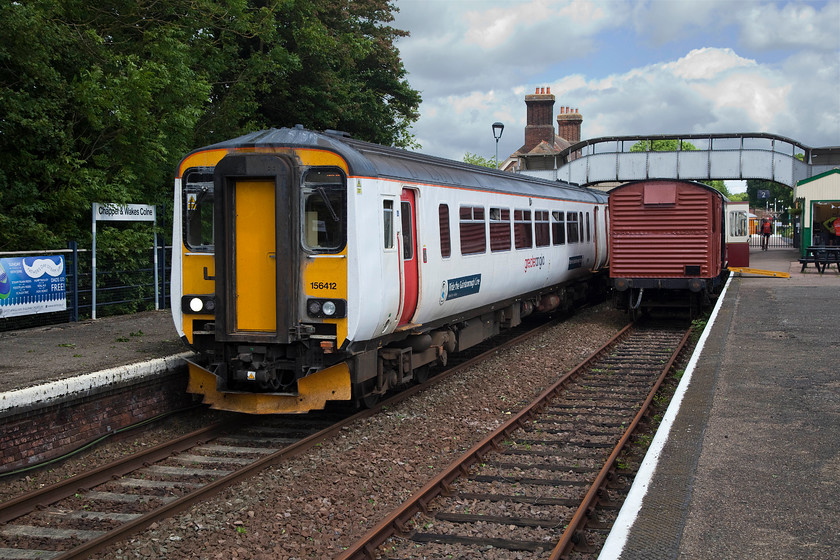 156412, 11.26 Sudbury-Marks Tey (2T13, RT), Chappel & Wakes Colne station 
 Greater Anglia's 156412 leaves Chappel & Wakes Colne station with the 11.26 Sudbury to Marks Tey working. The picture is taken from the platform of the East Anglian Railway Museum. It's a little incongruous to have a Network Rail service passing through and stopping at what is ostensively a preserved station. However, it's good to have the railways 'joined up' snd working together to support each other. 
 Keywords: 156412 2T13 Chappel & Wakes Colne station