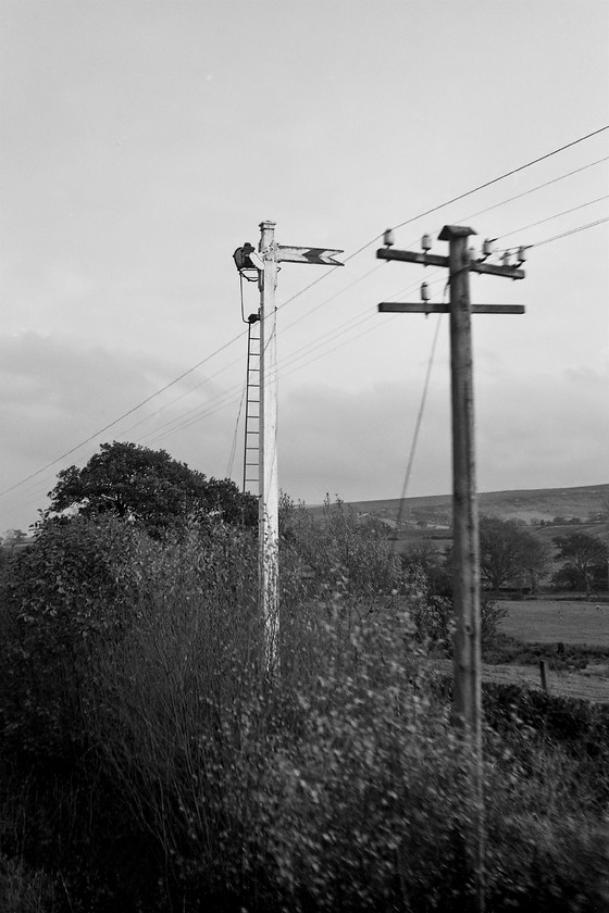 Ex NER wooden upper quadrant signal, Commondale 
 I noticed this strange and abandoned signal on the way out in the morning and vowed to get a photograph of it on my return. Taken from a Class 101 DMU as we leave the tiny halt at Commondale is this tall timber former NER distant signal complete with a wooden arm. I suspect that it was in connection with the short spur that headed north from the station to the Cleveland Fire Brick & Pottery Company that operated from 1860 until closure in 1947. Local advice would be appreciated on the history of this signal, please! 
 Keywords: NER wooden upper quadrant signal Commondale North Eastern Railway