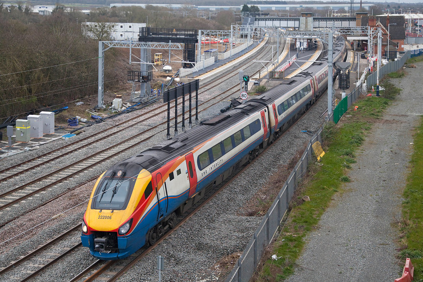 222006, EM 07.35 London St. Pancras-Nottingham (1D09, 4L), Wellingborough Driver Way bridge 
 Taken from the lofty heights of the newly opened Driver Way bridge, Wellingborough station is seen in the later stages of its re-build as 222006 'The Carbon Cutter' passes working the 07.35 St. Pancras to Nottingham. Whilst this new view is a welcome addition, the arrival of the wiring being strung between the registration arms will interfere with the images coming between the train and the lens! 
 Keywords: 222006 07.35 London St. Pancras-Nottingham 1D09 Driver Way bridge East Midlands Railway EMR Meridian The Carbon Cutter