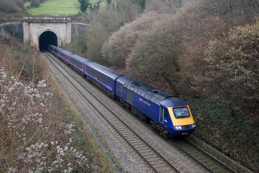 43024, GW 10.30 London Paddington-Bristol Temple Meads (1C10), Box Tunnel 
 43024 'Great Western Society 1961-2011 Didcot Railway Centre' emerges from the confines of Box Tunnel leading the 10.30 London Paddington to Bristol Temple Meads. I was pushing the ISO of the camera a little here as it was pretty dark down in the cutting and I needed a fairly fast shutter speed to capture the HST with no motion blur. 43024 was part of set 253012 when delivered new to the Western Region in 1976. It has thus spent all of its 41 years of service racing up and down this line (along with the West of England line). I think this represents good value for money in anybody's books! 
 Keywords: 43024 1C10 Box Tunnel