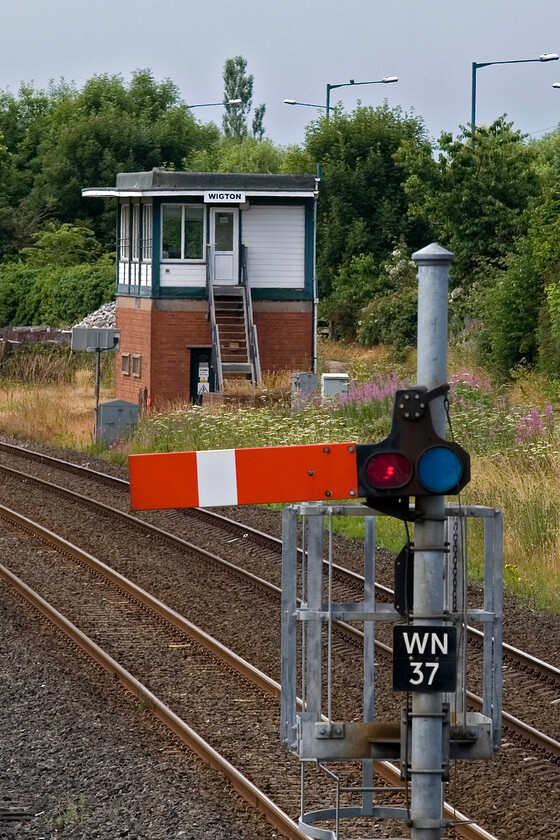 Wigton signal box (BR, 1957) & up starter 
 Both the signal (WN37) and the box are more recent replacements here at Wigton. The British Railways (London Midland) box dates from 1957 but I can find nothing about why and what it replaced....local knowledge anybody? The signal post and possibly the arm too are recent replacements. I do find the galvanized postwork rather ugly. When I process my 1985 image taken of the box I will put a link here. 
 Keywords: Wigton signal box BR up starter