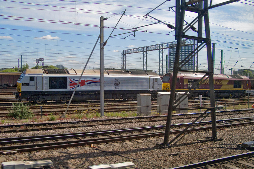 67026 & 67008, stabled, Sudbury Junction 
 Passing Sudbury Junction in Wembley yard reveals two stabled class 67s. To the left is 67026 'Diamond Jubilee' that was named on 12th October 2007 at Rugeley Trent Valley station, in honour of the sixtieth wedding anniversary of Queen Elizabeth II and the Prince Philip. To the right is 67008 in the more traditional EWS livery even though it now operated by DB Cargo. 
 Keywords: 67026 67008 Sudbury Junction Diamond Jubilee Wembley yard