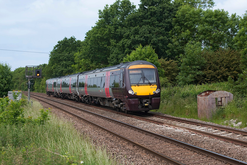 170102, XC 12.22 BNS-Stansted Airport (1L40, 6L), Egleton SK869070 
 With the sun very weak now behind the cloud that the Met. Office had not ordered, 170102 forms the Cross Country 12.22 Birmingham New Street to Stansted Airport.. I deliberately wanted the train to be between Oakham's distant colour light (OM12R), operated from the signal box by the station and the dilapidated corrugated iron linesman's hut. Two antiquities that may not be around for much longer? 
 Keywords: 170102 1L40, 6L Egleton SK869070