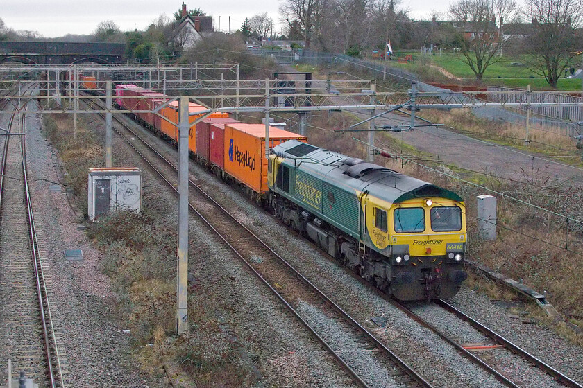 66418, 11.48 Lawley Street-London Gateway (4L46, 4E), site of Roade station 
 66418 Patriot In Memory of Fallen Railway Employees leads the 11.48 Lawley Street to London Gateway Freightliner through a now very grey and dull winter's afternoon. This was a disappointment after the bright and sunny morning. 
 Keywords: 66418 11.48 Lawley Street-London Gateway 4L46 site of Roade station Patriot In Memory of Fallen Railway Employees Freightliner