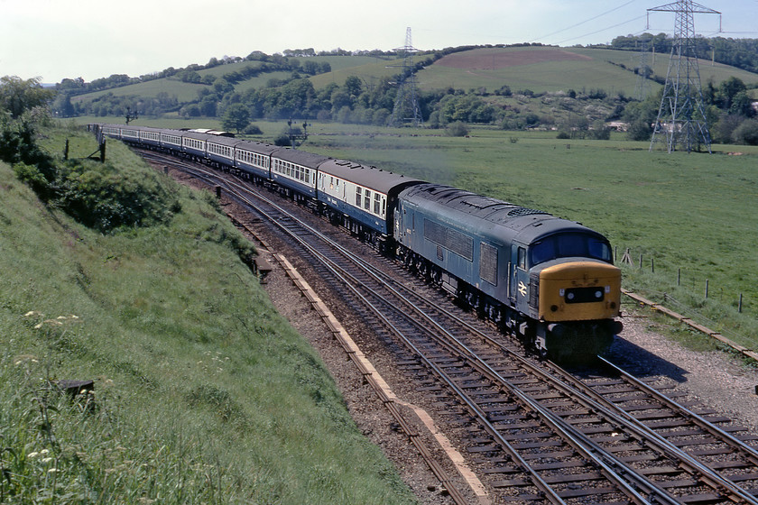 46012, 07.57 Penzance-Liverpool, Cowley Bridge Junction 
 In a seemingly bucolic scene at Cowley Bridge Junction 46012 picks up speed away from its stop at Exeter working the 07.57 Penzance to Liverpool Lime Street. I say that the scene appears rural in nature but I am standing on a busy and narrow road bridge at the junction with the A396 and the houses of Exeter to my left. The Peak will have worked this service to Birmingham New Street (unless it had a stop at Gloucester where there would have been an engine change) and from New Street, an AC electric would take it onwards to its destination. 
 Keywords: 46012 07.57 Penzance-Liverpool Cowley Bridge Junction