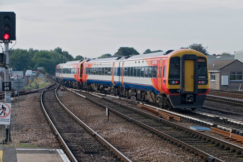 158881 & 158882, ECS shunting into platform 5, Salisbury station 
 Having just arrived with a service from Waterloo and terminated consecutively numbered 158881 and 158882 move out of the station and cross over from the down to the up line. The pair of units will then run back into the station and prepare for their next service. 
 Keywords: 158881 158882 ECS shunting into platform 5 SWT South West Trains Salisbury station