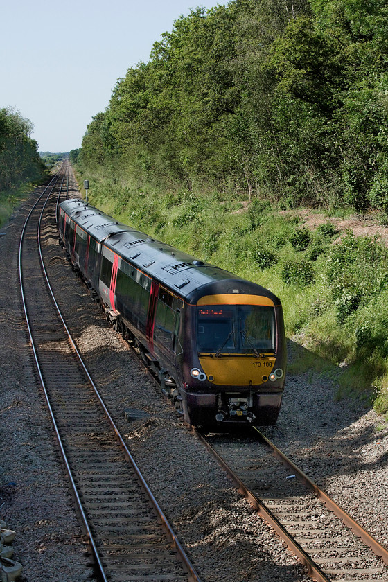 170108, XC 14.07 Nottingham-Cardiff Central (1V11, 8L), Croome Perry Wood SO900459 
 170108 passes Croome Perry Wood in south Worcestershire with the 14.07 Nottingham to Cardiff Central 1v11 service. When I visited this spot on an equally superb day during Easter 1984 Peaks worked these train hauling a rake of Mk. I stock, is their replacement by a glorified DMU progress....I'll let you decide! 
 Keywords: 170108 14.07 Nottingham-Cardiff Central 1V11 Croome Perry Wood SO900459