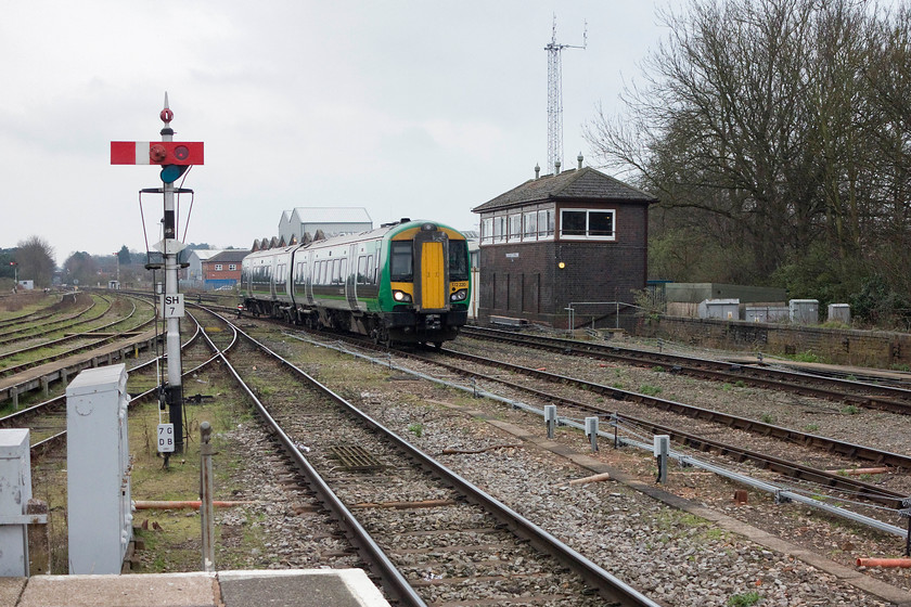 172220, running round, Worcester Shrub Hill station 
 172220, having completed its journey from Whitlocks End, runs round at Worcester Shrub Hill station. To the left is the centre-pivoted up platform starter signal that once had a lower arm distant for Wylds Lane Junction just up in the distance. The signal box is actually quite late being a Type 11 of 1935 vintage. The construction of the ugly communications mast has spoilt this view somewhat. 
 Keywords: 172220 Worcester Shrub Hill station