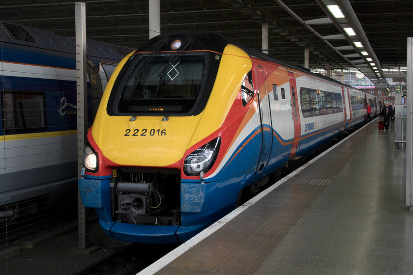 222016, EM 13.47 London St. Pancras-Corby (1M28, RT), London St. Pancras station 
 Under the roof of St. Pancras station, that was opened in 2007, 222016 waits to depart with the 13.47 to Corby. This was our train back to Wellingborough. My wife commented at how much nicer the seats were on this East Midlands train than on our more usual London Northwestern class 350. Apart from the vibration and noise from the under-carriage Cummins engines, the ambiance was better in the Meridians but the ride was a bit jittery on some of the Midland mainline track work. 
 Keywords: 222016 13.47 London St. Pancras-Corby 1M28 London St. Pancras station