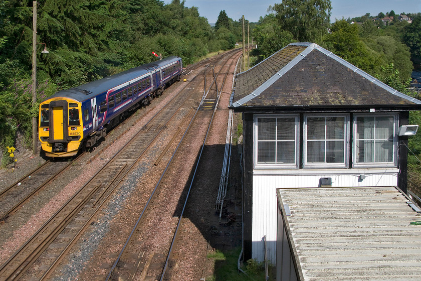 158730, SR 11.17 Dunblane-Dunblane ecs (5P36), Dunblane 
 Another image of 158730 working the 11.17 Dunblane to Dunblane 5P36 out and back reversal move. In this view, the 1902 Caledonian box is to the right and with this end-on view, the unusual crowstep gabled roof clearly seen. Notice the up main home (DB6) is pulled off so once the unit has joined the down main it will have to wait until the up train has passed before it can crossover. 
 Keywords: 158730 11.17 Dunblane-Dunblane ecs 5P36 Dunblane station ScotRail Empty coaching stock Super Sprinter