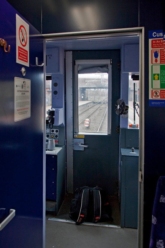 Rear cab, 319383, NT 10.03 Wigan North Western-Liverpool Lime Street (2C15, 3L), St 
 The conductor left the crew's door open at the back of 319383 thus enabling a quick and unusual picture taken out of the back of the train. The train is just leaving St. Helens Central station and its two shunting disk signals can be seen. 
 Keywords: Rear cab 319383 2C15 St. Helens Central Station