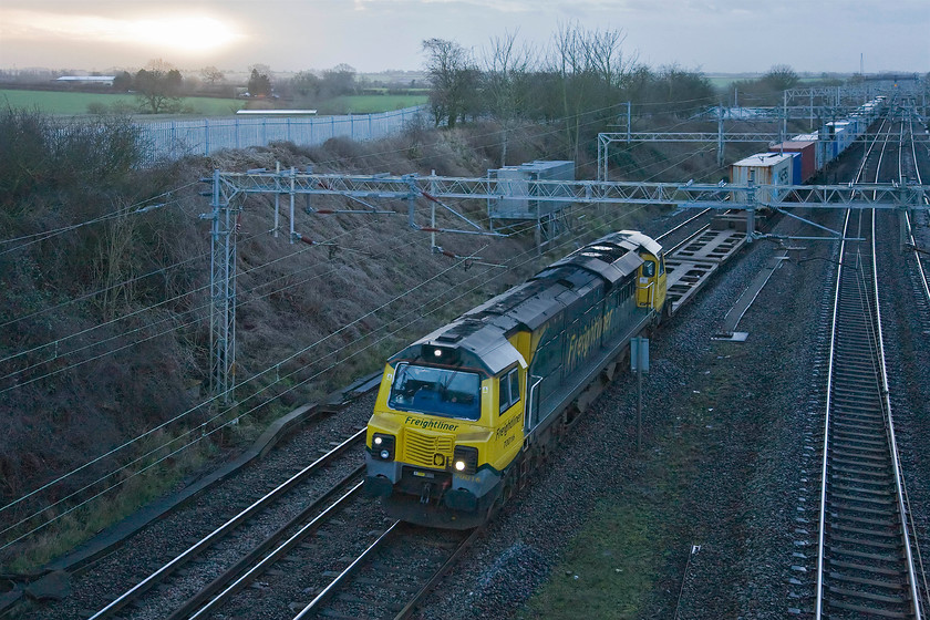 70016, 03.09 Felixstowe North-Ditton (4M45), Victoria bridge 
 Shattering the early morning peace and quiet at Victoria bridge, 70016 leads the 03.09 Felixstowe to Ditton Freightliner northwards. I could hear this Class 70 some distance away as it approached and passed Hanslope Junction reinforcing the widely held view that this relatively new design of locomotive remains one of the noisiest on the network. 
 Keywords: 70016 03.09 Felixstowe North-Ditton 4M45 Victoria bridge Freightliner