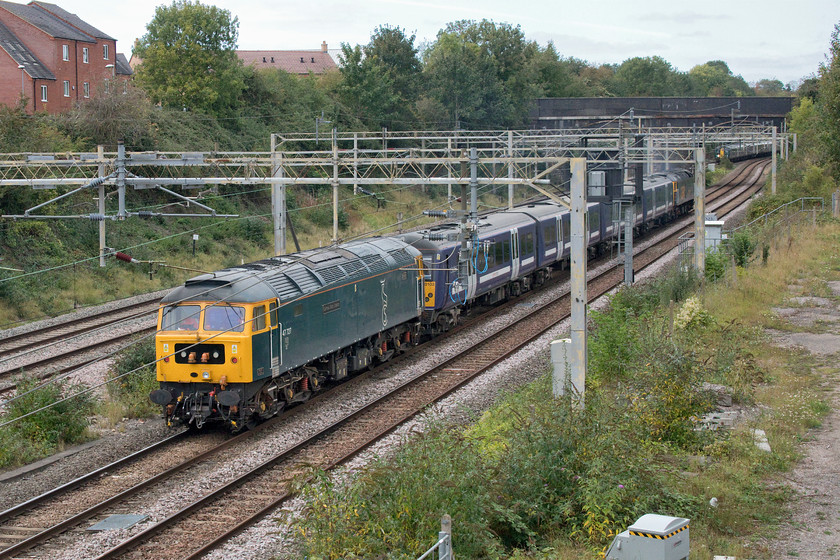 47727, 360103 & 47739, 11.52 Ilford EMUD-Northampton EMD (5Q60, 3E), site of Roade station 
 Another former GA Class 360 is seen being taken from its base at Ilford to the Northampton Siemens facility for modifications enabling it to run on the MML between St. Pancras and Corby. On this dull Sunday afternoon at Roade 47727 'Edinburgh Castle/Caisteal Dhun Eideann' brings up the rear of the train running as 5Q60 with 47739 leading at the front. Last week this train ran by the book with a lengthy stopover at Milton Keynes. This week it was running late on leaving the London area, as were all other workings, so it simply passed straight through thus recovering all of its lost time to arrive at Northampton early! 
 Keywords: Edinburgh Castle Caisteal Dhun Eideann GBRf 47727, 360103 & 47739, 11.52 Ilford EMUD-Northampton EMD (5Q60, 3E), site of Roade station