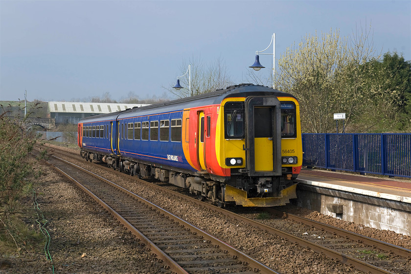 156405, EM 09.26 Nottingham-Worksop (2W06), Whitwell station 
 156405 arrives at Whitwell station forming the 09.26 Nottingham to Worksop service. The station was opened in 1875 with trains operated by both the Midland and the Manchester, Sheffield and Lincolnshire Railway. The station was closed by British Railways in 1964 with the station building dismantled brick by brick and rebuilt at Butterley to become the heritage Midland Railway's main station in 1981, see....... https://www.midlandrailway-butterley.co.uk/butterley-station/ 
 Keywords: 156405 09.26 Nottingham-Worksop 2W06 Whitwell station