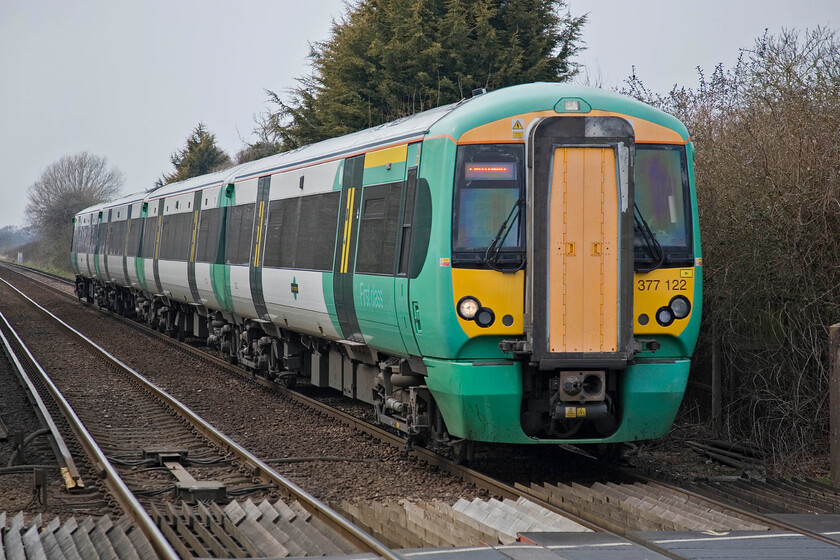 377122, unidentified up working, Southbourne station 
 Unfortunately, I have been unable to identify this Southern service passing Southbourne. 377122 is heading eastwards along the Coastway route in the direction of Brighton. Southbourne is one of a number of stations on this route that come one after another within a relatively short distance of each other. 
 Keywords: 377122 Southbourne station Southern Electrostar