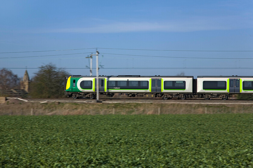 350254, LM 07.54 Birmingham New Street-London Euston, Milton Malsor SP740558 
 One of my favourite local spots to home is in the fields east of the line at Milton Malsor near Northampton. With a morning sun on your back watching and recording the passage of the various trains is a delight. The only thing that mars the experience is the noise from the nearby M1 motorway which is about half a mile behind me. 350254 leads the 07.54 Birmingham New Street to Euston service southwards past my spot. 
 Keywords: 350254 07.54 Birmingham New Street-London Euston Milton Malsor SP740558