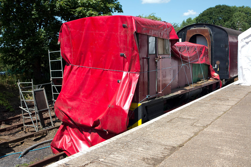 53, stored, Pitsford station yard 
 Built by Ruston and Hornsby at Lincoln in 1953 no. 53 'Sir Alfred Wood' is seen under cover at Pitsford station. The industrial shunter is undergoing some restoration but remains covered as at present the NLR has limited covered facilities. At the time of writing, they are appealing for funds so they can construct a new shed. 
 Keywords: 53, shunter Pitsford Yard