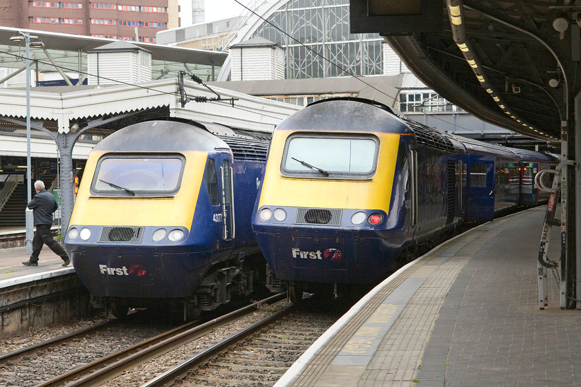 43177, GW 14.45 London Paddington-Swansea (1B46) & 43033, GW 15.00 London Paddington-Bristol Temple Meads (1C99), London Paddington station 
 At the country end of Paddington station two HSTs prepare to leave for the West Country. To the left 43177 will leave first in about five minutes time leading the 14.45 to Swansea. To the right, 43033 will leave in twenty minutes with the 15.00 to Bristol Temple Meads. 
 Keywords: 43 177 14.45 London Paddington-Swansea 1B46 43033 15.00 London Paddington-Bristol Temple Meads 1C99 London Paddington Station