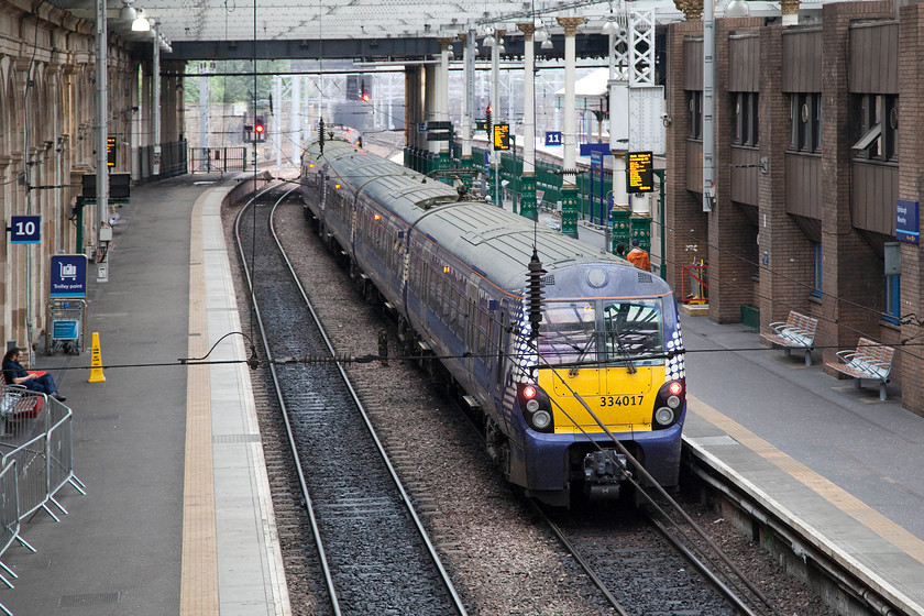 334017, SR 18.48 Edinburgh Wavereley-Helensburgh Central (2H43), Edinburgh Waverley station 
 Walking back to our hotel I had to cross the footbridge that goes from one side of Waverley to the other. I turned my camera and took this picture of 334017 waiting to leave with the 18.48 to Helensburgh Central. This is another service that crosses this part of Scotland from coast to coast. 
 Keywords: 334017 18.48 Edinburgh Wavereley-Helensburgh Central 2H43 Edinburgh Waverley station