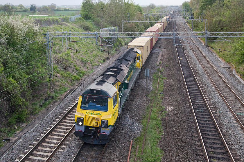 70008, 02.57 Felixstowe North-Ditton (4M45), Victoria Bridge 
 The class 70s will win no prizes for their Transatlantic styling but they do win some for their noise! A 70 sounds different and a lot noisier than all other modern motive power and living a short distance from the WCML as I do my ears always prick up when a 70 is passing across the field from home! 70008 passes under Victoria Bridge leading the long and heavily loaded 4m45 02.57 Felixstowe North to Ditton Freightliner. 
 Keywords: 70008 02.57 Felixstowe North-Ditton 4M45 Victoria Bridge