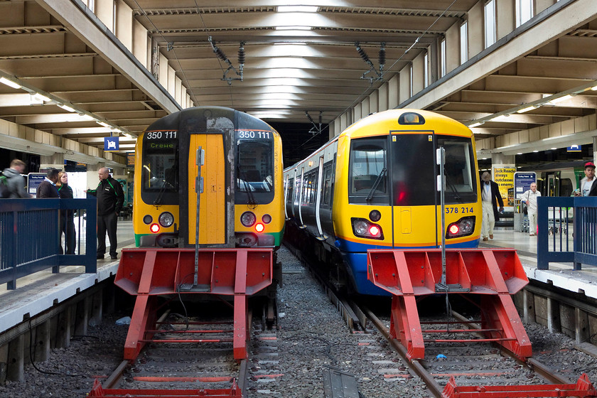 350111, LM 14.30 London Euston-Crewe (1U39, RT) & 378214, LO 14.37 London Euston-Watford Junction (2D72, 2E), London Euston station 
 Desiro V. Capitalstar, who would win in a game of top trumps? On speed, the Desiro has it but on capacity it would be the Capitalstar! Two similar designs but doing a different job so a direct comparison is not so easy I suppose. 350111 waits to leave Euston with the 14.30 to Crewe whilst 378214 is about to leave with the 14.37 to watford Junction. 
 Keywords: 350111 1U39 378214 2D72 London Euston station