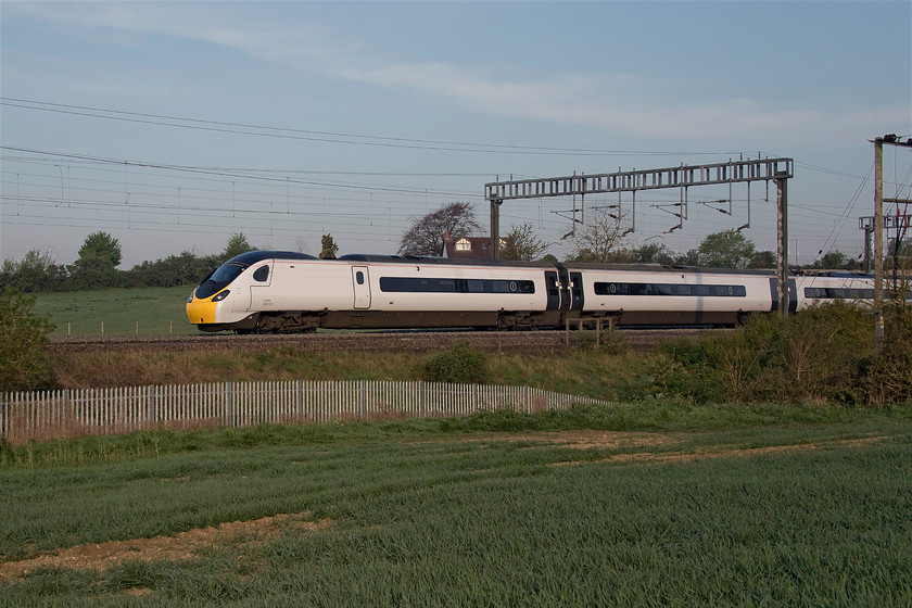 390157, VT 05.12 Lancaster-London Euston (1R07, 3L), between Roade & Ashton 
 At a walking pace being held behind two freights, one of which was moving from the up fast to the slow at Hanslope Junction, 390157 'Chad Varah' is seen working the 05.12 Lancaster to Euston. The Avanti West Coast operated Pendolino is seen between Roade and Ashton in south Northamptonshire. 
 Keywords: 390157 05.12 Lancaster-London Euston 1R07 between Roade & Ashton Avanti West Coast Pendolino Chad Varah