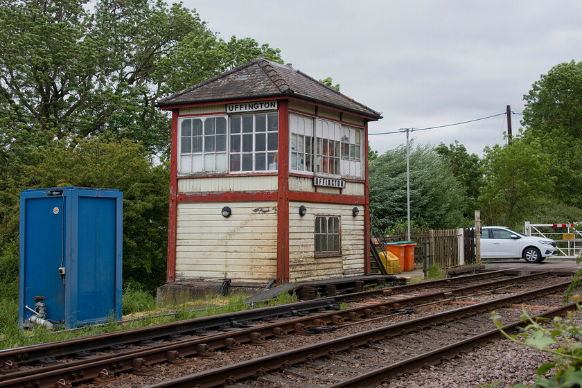 Uffington signal box (Midland, 1909) 
 I have several photographs of Uffington signal box over the years from when I first visited this spot with Graham during our grand summer trip in August 1981, see..... https://www.ontheupfast.com/p/21936chg/30044135645/uffington-signal-box Some forty-three years later it is still going strong but beginning to look a little tatty again. I wonder if it will be in receipt of any further maintenance or if it will be nursed through until the inevitable closure comes sooner rather than later. 
 Keywords: Uffington signal box Midland