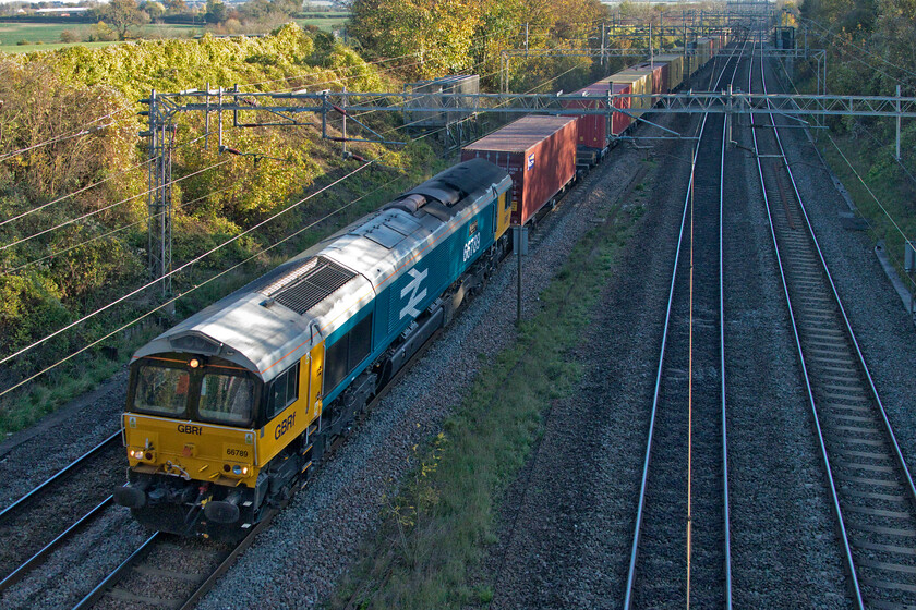 66789, 11.39 London Gateway-Hams Hall (4M47, 44L), Victoria bridge 
 66789 'British Rail 1948-1997' was re-liveried and named in February 2018 and has evaded my camera ever since! I was not aware that it was leading the 4M47 11.39 London Gateway to Hams Hall service so when it passed I was particularly pleased that I had made the spontaneous walk out from home! The only disappointment was that it is largely in shadow due to the low-angled sun but a capture is a capture! 
 Keywords: 66789 11.39 London Gateway-Hams Hall 4M47 Victoria bridge British Rail 1948 - 1997