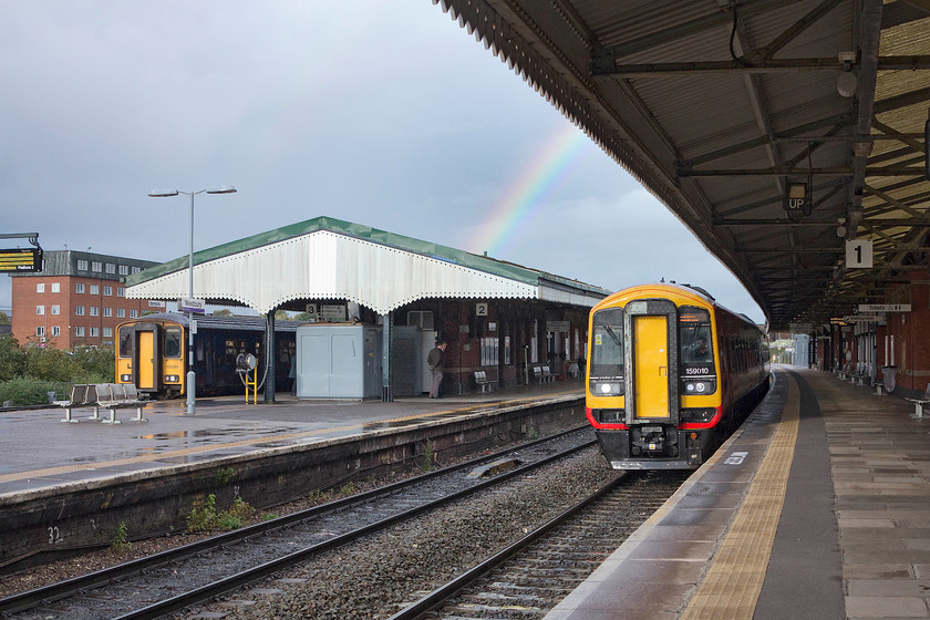 159010, SW 15.51 Bristol Temple Meads-Salisbury & London Waterloo (1O60 & 1L60) & 150265, GW 15.08 Weymouth-Gloucester (2E26), Westbury station 
 On arrival at Westbury it had just rained again (as it had done on and off throughout the day). We had just travelled from Bristol and had alighted from 159010 that was working the 15.51 Bristol to Salisbury and then London Waterloo. On platform three, 150265 is waiting to depart forming the 15.08 Weymouth to Gloucester. 
 Keywords: 159010 15.51 Bristol Temple Meads-Salisbury London Waterloo 1O60 1L60 150265 15.08 Weymouth-Gloucester 2E26 Westbury station