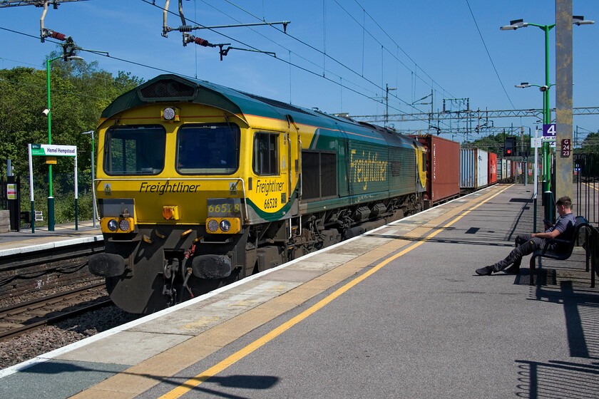 66528, 09.32 Felixstowe North-Ditton (cancelled from Crewe Basford Hall) (4M88, 1L), Hemel Hempstead station 
 Having completed our walk along the Nickey Line from Harpenden Andy, Mike and I returned to more normal fare at Hemel Hempstead station! With problems on the lines further south towards Euston northbound locals were subject to delays and cancellations. Whilst waiting for a later train that would drop us at Tring 66528 'Madge Elliott MBE Borders Railway Opening 2015' passed northwards leading the 4M88 Feisxtowe to Ditton Freightliner. Unfortunately, this train ran into difficulties later in its journey being terminated at Crewe Basford Hall. 
 Keywords: 66528 09.32 Felixstowe North-Ditton cancelled from Crewe Basford Hall 4M88 Hemel Hempstead station Madge Elliott MBE Borders Railway Opening 2015