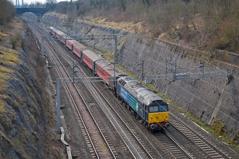 47501, 08.46 Crewe-Wembley footex (1Z81), Roade cutting 
 47501 'Craftsman' brings up the rear of 08.46 Crewe to Wembley footex charter as it passes through Roade cutting as 1Z81. After beating Southend United 2-0 in the Johnstone's Paint Football League Trophy Final Crewe Alexandra supporters would return happy later in the day and I was planning to pop out again and photograph the train; unfortunately, things did not go quite to plan! 
 Keywords: 47501 08.46 Crewe-Wembley footex 1Z81 Roade cutting DRS Craftsman