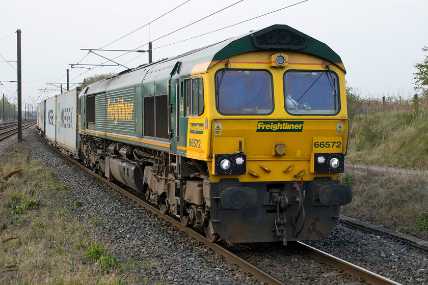 66572, 16.12 Tees Dock-Felixstowe North (4L79), Thirsk station 
 As we were driving the relatively short distance between Northallerton and Thirsk I was aware that, according to Realtime Trains, the 16.12 Tees Port for Felixstowe Freighliner was bearing down on us! Andy put his foot down a bit (as much as you can do in a 1000cc 2002 Nissan Micra!) and we ended up getting to Thirsk with a good few minutes in-hand. 66562 passes through the station on the up slow line going at a fair lick. This is a pretty regularly photographed class 66 for me, having seen it all over the country. 
 Keywords: 66572 16.12 Tees Dock-Felixstowe North 4L79 Thirsk station