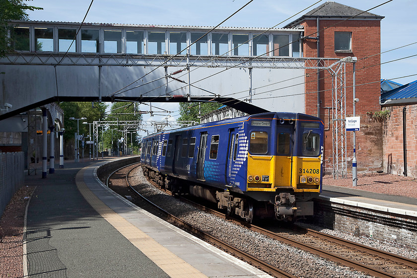 314208, SR 12.54 Gourock-Glasgow Central (1G08, RT), Port Glasgow station 
 314208 arrives at Port Glasgow station working the 12.54 Gourock to Glasgow Central. Port Glasgow is situated the south side of the Firth of Clyde and owes its historical success to shipbuilding. It has many fine buildings but does now have a air of decay. Much has been done in recent years to clear many of the derelict industrial building on the waterfront in an effort to rejuvenate the town. 
 Keywords: 314208 1G08 Port Glasgow station