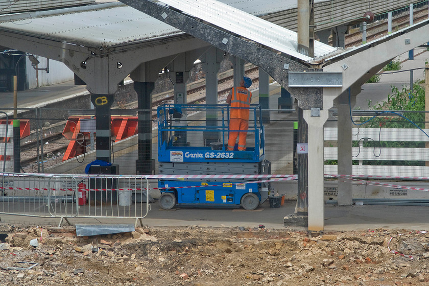 Demolition of old Northampton station 
 A member of staff works to sort out the electrics under the canopy of the old Northampton station. The re-building and upgrade of the station are virtually complete but very little has been done to increase its train capacity, will the planner s at Network Rail rue the day that this was not looked at? 
 Keywords: Demolition of old Northampton station