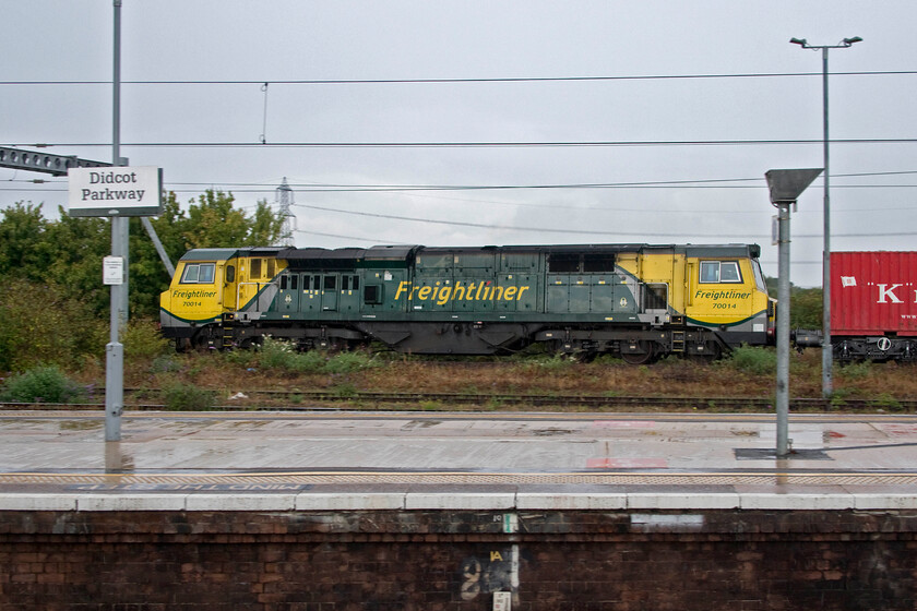 70014, 12.24 Southampton MCT-Trafford Park (4M61, 2E), Didcot station 
 A light pan. photograph (taken at 1/320th sec) shows 70014 leading the 12.24 Southampton to Trafford Park Freightliner passing Didcot on the avoiding line. The Class 70s will never win any prizes in the locomotive beauty parade (from any particular angle!) but they have proved to be, after the inevitable teething problems, to be reliable and competent in operation. I always make a point of photographing them when on my railway travels as they rarely put in appearances close to home on the WCML. 
 Keywords: 70014 12.24 Southampton MCT-Trafford Park 4M61 Didcot station Freightliner