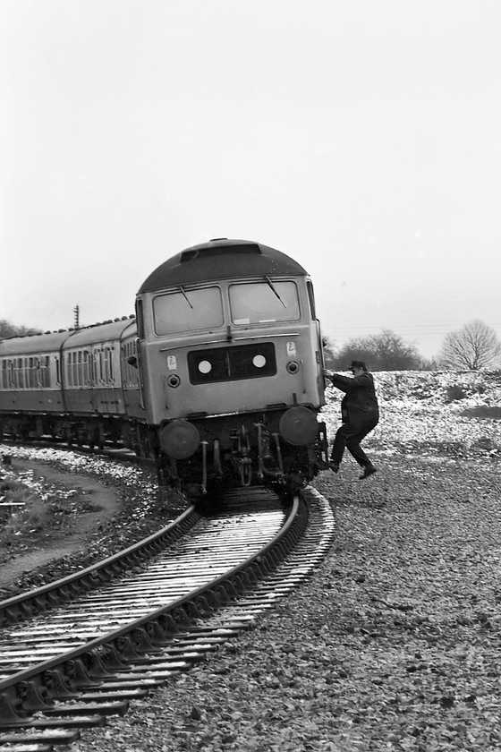 47069, outward leg of The Pines Express, 07.48 London Paddington-Weymouth (via Bristol & various freight lines), Bradford North Junction 
 Having got the necessary permissions to proceed, the driver climbs back into the cab of 47069 to get the very late running Pines Express railtour underway over Bradford North Junction and down into the Avon Valley towards Bath. Already the train was well over an hour late and the passengers would have been cold on this chilly March morning as there had been no train heating since the train left Paddington! 
 Keywords: 47069 The Pines Express 07.48 London Paddington-Weymouth Bradford North Junction