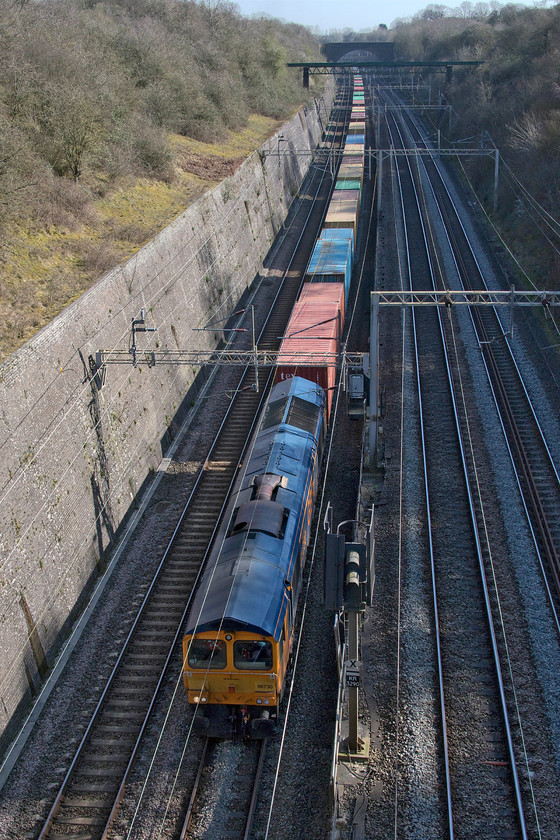 66730, 10.36 Felixstowe North-Hams Hall (4M23, 2L), Roade cutting 
 In a break from the norm, GBRf's 66730 'Whitemoor' leads the heavily loaded 10.36 Felixstowe North-Hams Hall 4M23 Freightliner through Roade cutting. I say this as the majority of down Freightliner workings have been running almost empty due to the lack of imports due to the Covid-19 pandemic crippling the normal way things are done. 
 Keywords: 66730 10.36 Felixstowe North-Hams Hall 4M23 Roade cutting GBRf Whitemoor