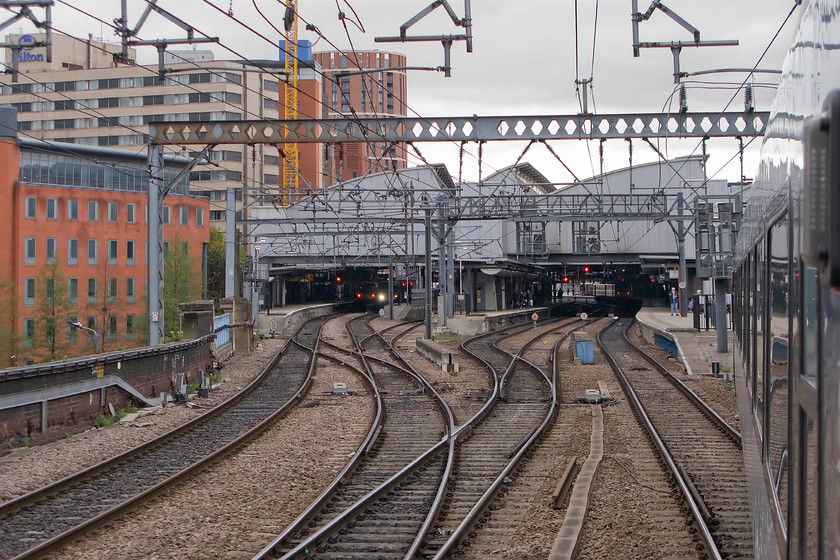 Entering Leeds station 
 Taken from our hst as we enter Leed station from the east. Opened after a huge re-build in 2002 the design of the roof was to let a lot more light on to the platforms. However, this re-build may not be enough as passenger numbers are rising steadily and predicted to rise further with considerable pressure on the present station likely. The northern terminus of HS2 is also going to be within the vicinity too! 
 Keywords: Entering Leeds station