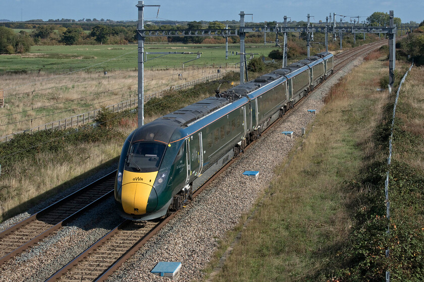 800009, GW 11.48 London Paddington-Swansea (1B13, 6L), South Marston SU193869 
 800009 'Sir Gareth Edwards/John Charles' makes a fine sight in some superb autumn weather as it approaches Swindon at South Marston working the 11.48 Paddington to Swansea service. I have to question if a five-car EMU is acceptable for a long-distance express service such as the 1B13. These units replaced HSTs with much greater capacity that themselves replaced locomotive-hauled trains of up to twelve coaches. 
 Keywords: 800009 11.48 London Paddington-Swansea 1B13 South Marston SU193869 GWR IET Sir Gareth Edwards / John Charles