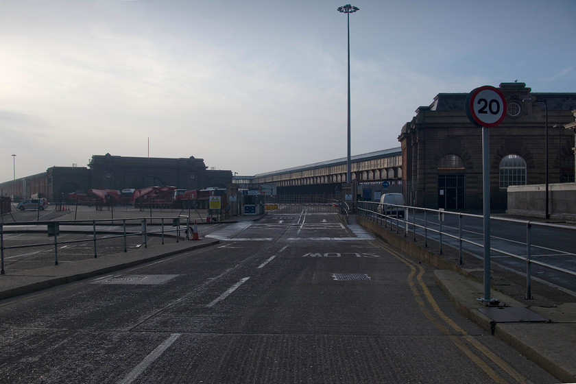 Former Dover Marine station 
 To the right is the foot passenger entrance to Dover Marine (Western Docks) station. The passengers then walked along the raised and covered walkway and into the station that dominated the background. The area in the foreground was filled by a complex of railway lines. The station closed in 1994 and soon afterwards the tracks and other infrastructure was removed. The station, opened by the South Eastern and Chatham Railway in 1915 (with public use commencing in 1919), is grade II listed and in use a cruise terminal. 
 Keywords: Dover Marine station