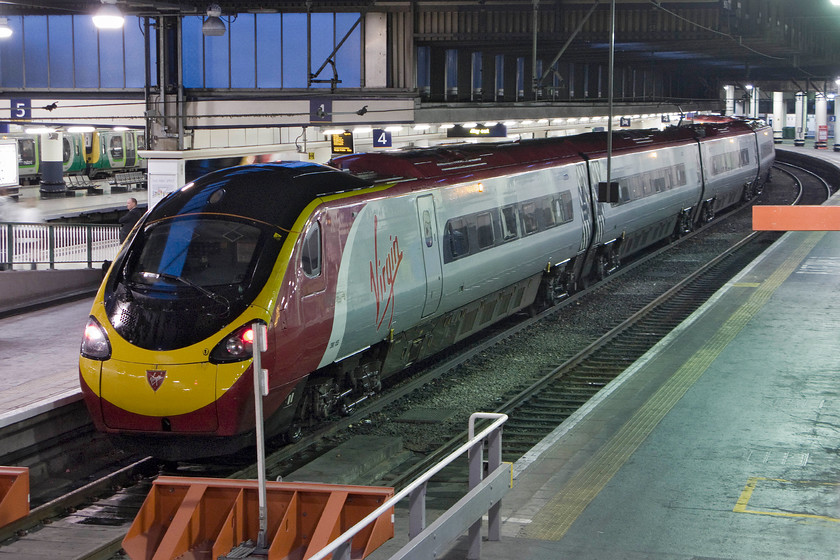 390155, VT 19.23 London Euston-Wolverhampton (9G41), London Euston station 
 On returning to Euston station after our superb day out in London 390155 sits at platform four ready to work north with the 19.23 to Wolverhampton. As can be seen from the nose of the Pendolino, after a lovely start to the day it is now raining. 
 Keywords: 390155 19.23 London Euston-Wolverhampton 9G41 London Euston station Virgin Pendolino