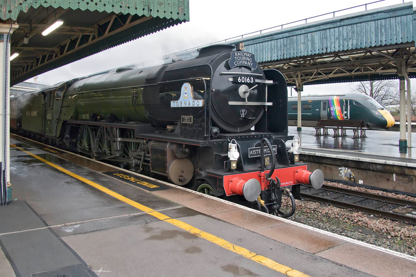 60163, outward leg of The Bath & Cardiff Christmas Markets, 07.14 London Paddington-Cardiff Central (1Z41) & 800008, GW 09.30 London Paddington-Bristol Temple Meads (1C08, 8L), Bristol Temple Meads station 
 On arrival at Bristol Temple Meads, Peppercorn A1 60163 'Tornado' had just arrived leading The Bath & Cardiff Christmas Markets charter from Paddington. As 1Z41 it travelled via the Berks. and Hants. route to Westbury where it took the east curve to Hawkeridge Junction to then travel down the Avon Valley to Bath where some passenger alighted to enjoy the Bath Christmas market. Those passengers who opted to stay on the train to continue to Cardiff may have regretted their decision as instead of the train leaving the mainline at North Somerset Junction to rejoin the recently re-quadrupled line at Dr. Day's Junction it went into Temple Meads. The reason for this unscheduled move was a failure (or broken down train as the announcer persistently referred to it) somewhere between Filton Abbey Wood and Severn Tunnel Junction. All trains to and from South Wales were subject to very heavy delays and/or cancellations. The charter sat at Temple Meads for about two hours before setting off for Cardiff with 60163 now being towed at the rear with some glum travellers who will have got a lot less time to enjoy the Christmas market than was intended. 
 Keywords: 60163 The Bath & Cardiff Christmas Markets 07.14 London Paddington-Cardiff Central 1Z41 800008 09.30 London Paddington-Bristol Temple Meads 1C08 Bristol Temple Meads station Great Western railway IET Tornado A1 Locomotive Trust WCR West Coast Railway