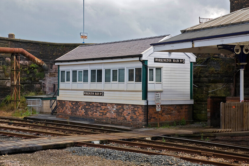 Workington Main No. 3 signal box (LNW, 1886) 
 Nestled between the platform end and an overbridge sits Workington Main No. 3 signal box. It is a LNWR Type 4+ built in 1886 but has been considerably modernised in more recent times with replacement cladding and windows. It once contained fifty-five levers but has been much reduced in more recent years to just twenty-five. 
 Keywords: Workington Main no. 3 signal box LNWR 188