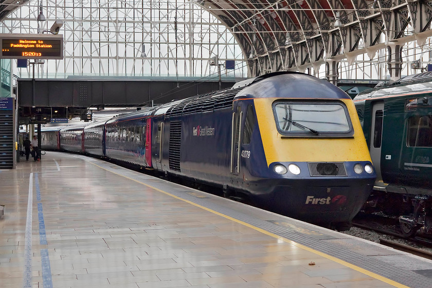 43079, GW 09.30 Penzance-London Paddington (1A82, 4L), London Paddington station 
 Having completed yet another 305 miles, 43079 arrives at London Paddington's platform one with the 09.30 1A82 from Penzance. After a clean and service, the train will be ready for another load of passengers to work west again. This is something that the HSTs have done successfully for over forty years now, there are no other trains that I can think of that hold this accolade? 
 Keywords: 43079 1A82 London Paddington station